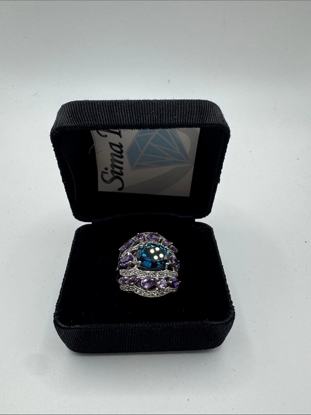 Sima K Blue Center Stone with Purple Accents Cocktail Ring